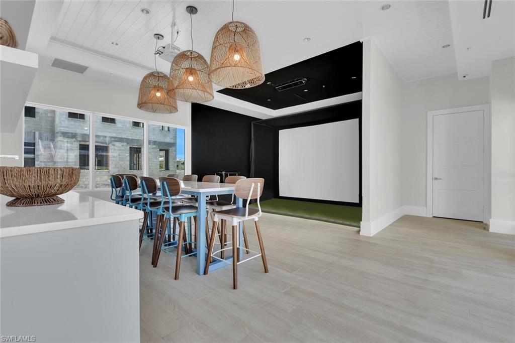 201 8th Street South, Unit 208 Naples, FL 34102 - Photo 35 of 46 a view of a dining room with furniture and chandelier