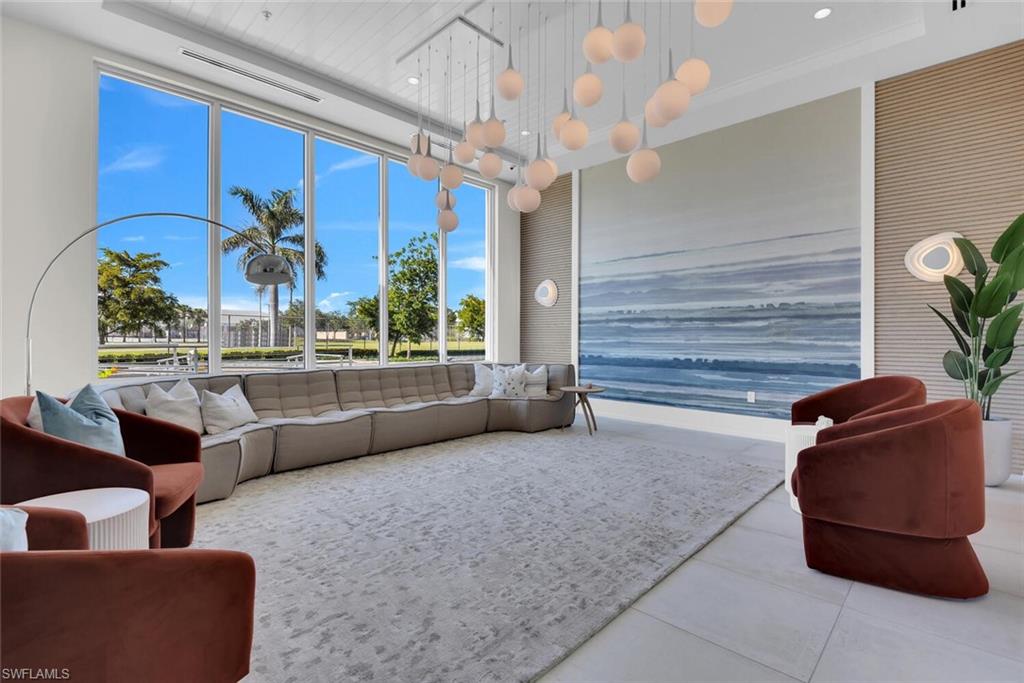 201 8th Street South, Unit 208 Naples, FL 34102 - Photo 39 of 46 a living room with furniture and a large window