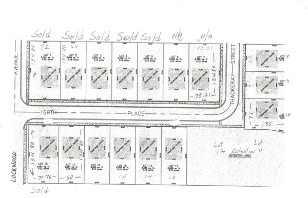 a black white and white photo of a living room