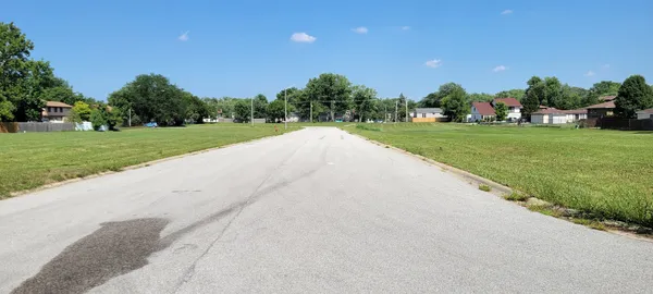 a view of building with outdoor space and trees