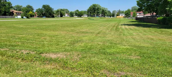 a view of a golf course with a yard