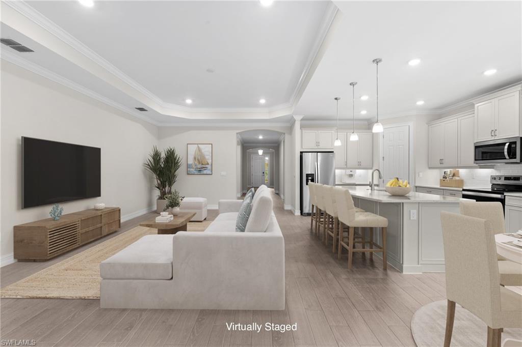 428 Polihale Way Naples, FL 34114 - Photo 3 of 35 Open Living Room into spacious Kitchen