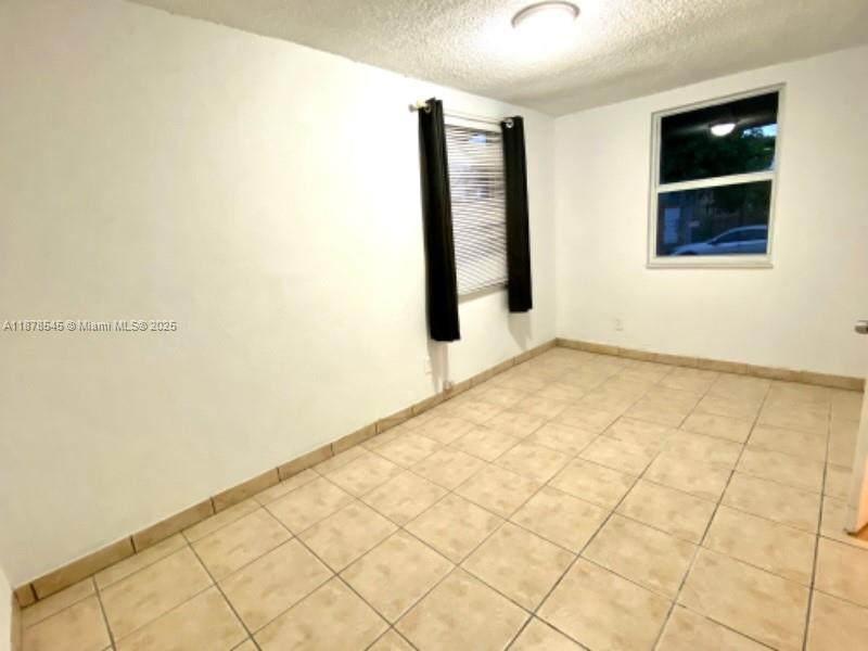 4307 Southwest 9th Street, Unit 4307 Miami, FL 33134 - Photo 5 of 12 a view of an empty room