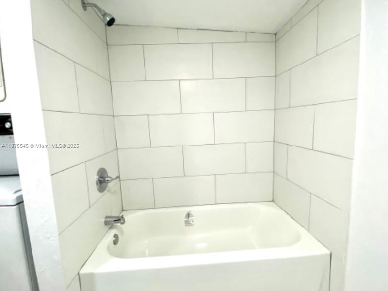 4307 Southwest 9th Street, Unit 4307 Miami, FL 33134 - Photo 7 of 12 a bathroom with a bathtub