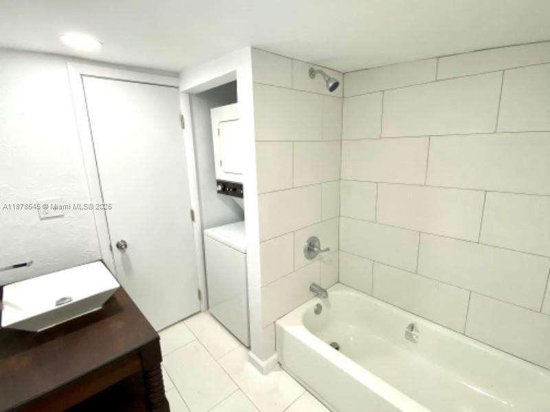 4307 Southwest 9th Street, Unit 4307 Miami, FL 33134 - Photo 8 of 12 a bathroom with a bathtub and a shower