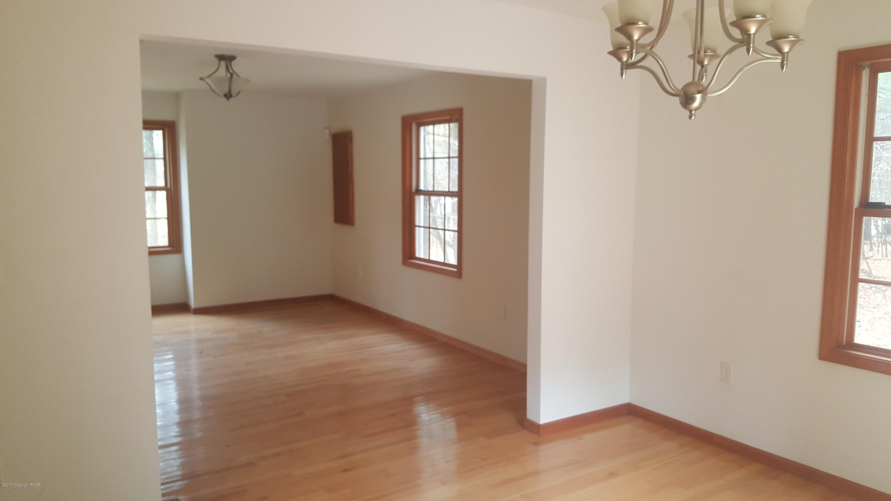 208 Fox Road Dingmans Ferry, PA 18328 - Photo 8 of 17 an empty room with windows and closet