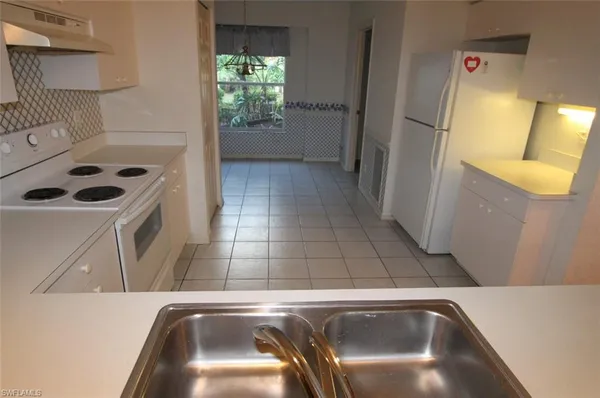 a close view of sink and washing machine