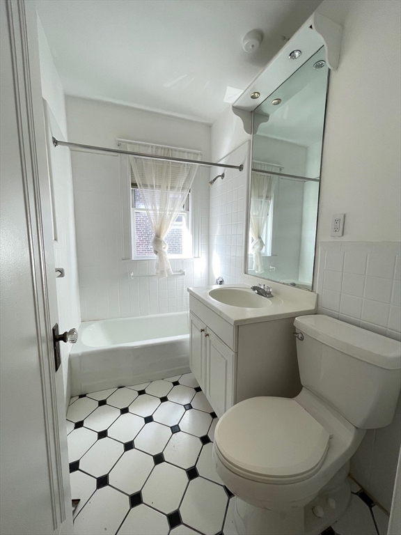 96 Walnut Street, Unit 2 Brookline, MA 02445 - Photo 13 of 13 a bathroom with a sink toilet and shower