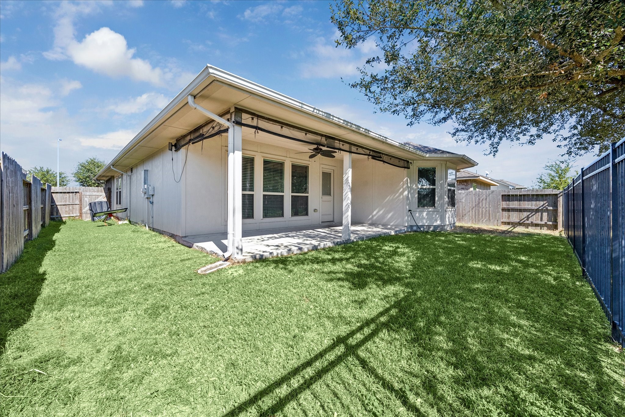 18203 Alora Springs Trace Cypress, TX 77433 - Photo 29 of 30 a front view of a house with a garden