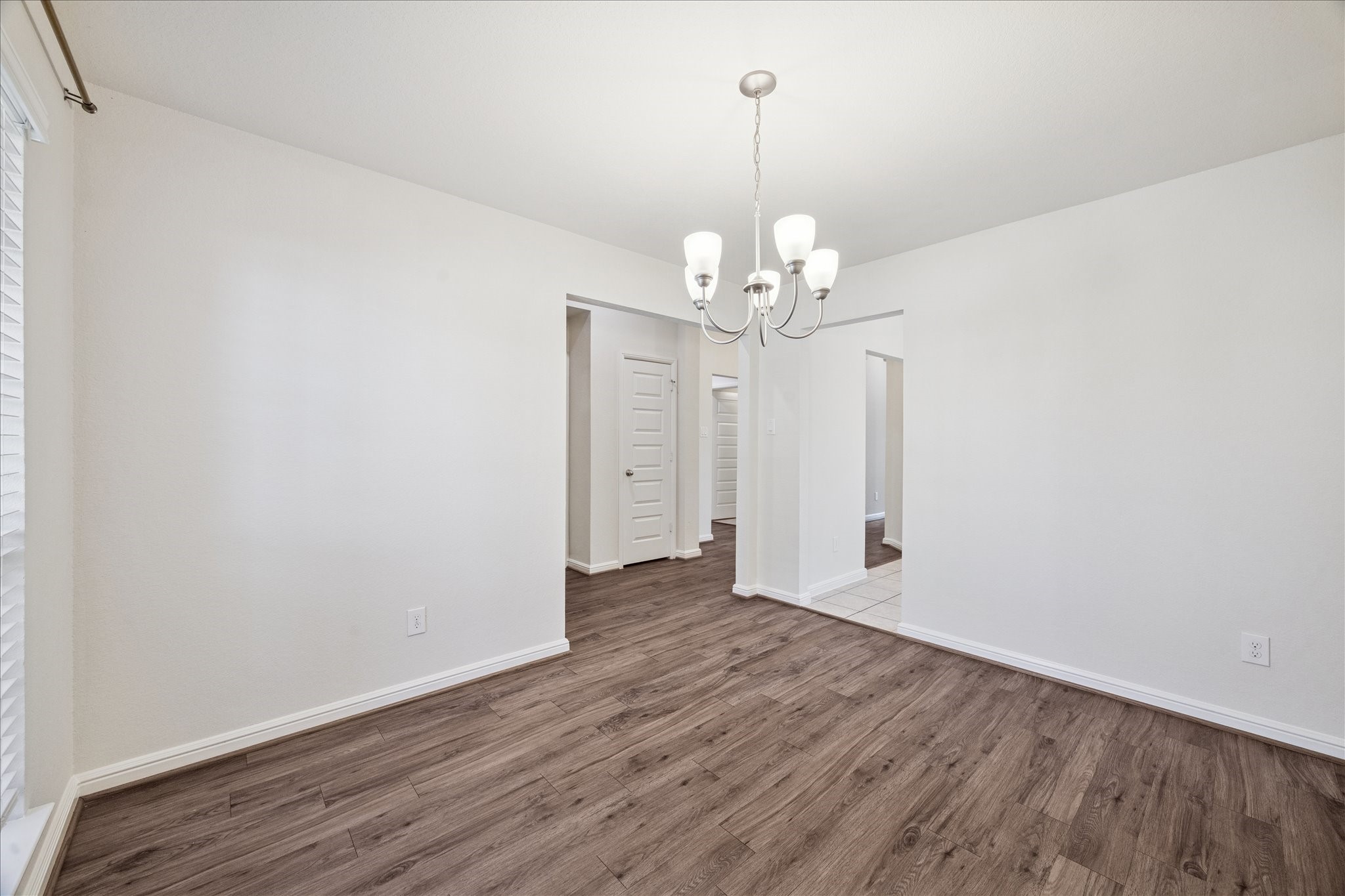 18203 Alora Springs Trace Cypress, TX 77433 - Photo 8 of 30 a view of an empty room with wooden floor