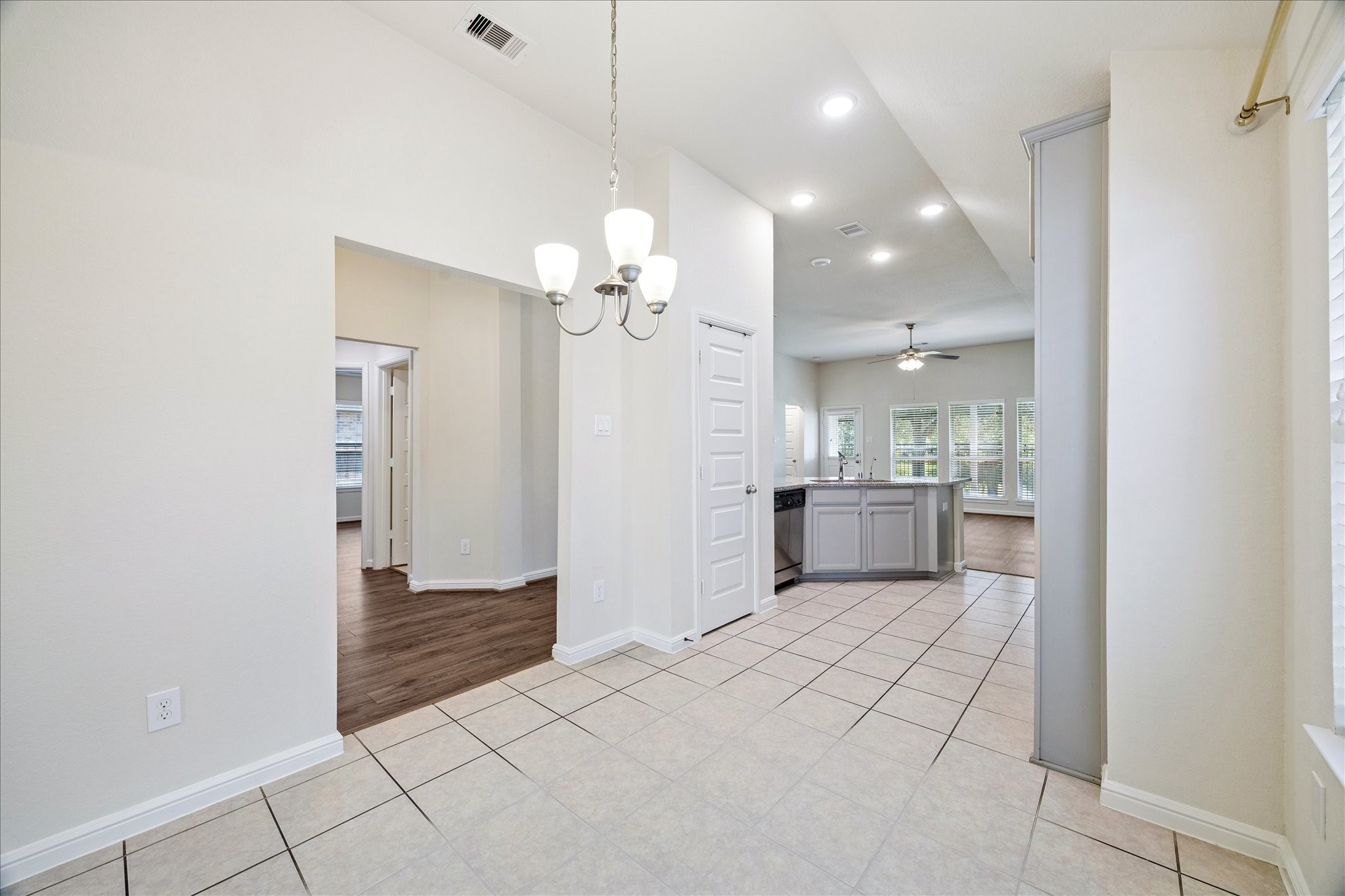 18203 Alora Springs Trace Cypress, TX 77433 - Photo 10 of 30 a view of a kitchen with a sink and a refrigerator