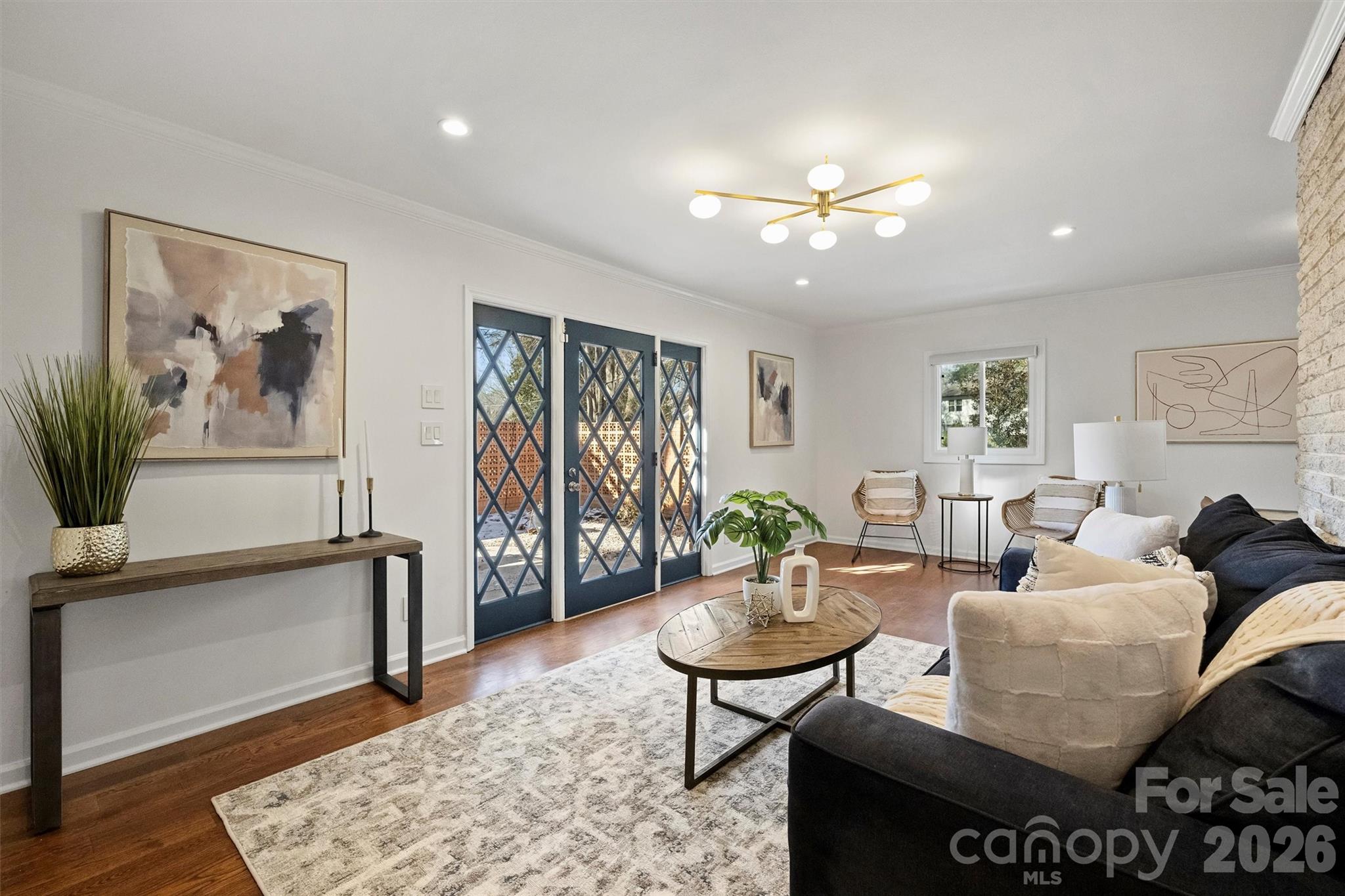 3808 Flowerfield Road Charlotte, NC 28210 - Photo 13 of 48 a living room with furniture and wooden floor