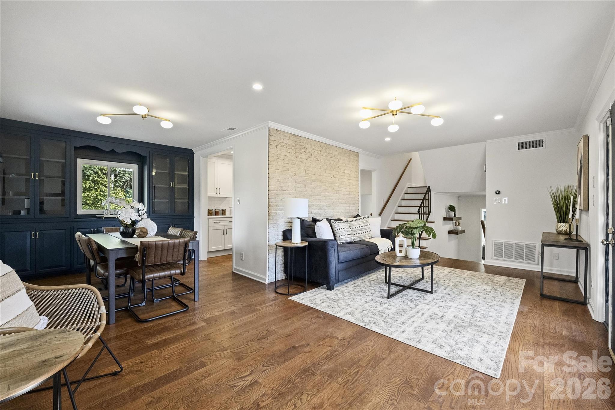 3808 Flowerfield Road Charlotte, NC 28210 - Photo 15 of 48 a living room with furniture and wooden floor
