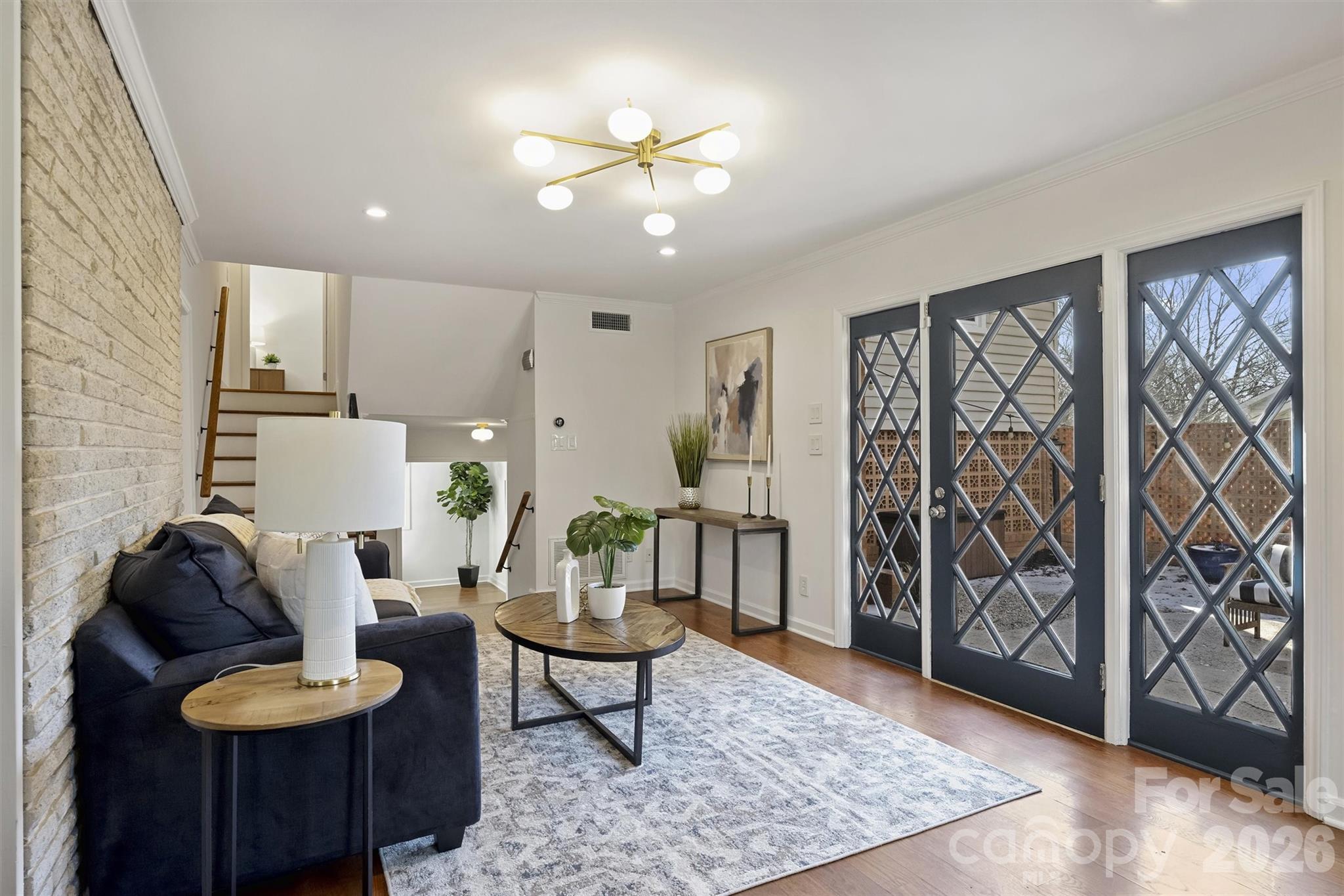 3808 Flowerfield Road Charlotte, NC 28210 - Photo 17 of 48 a living room with furniture and wooden floor