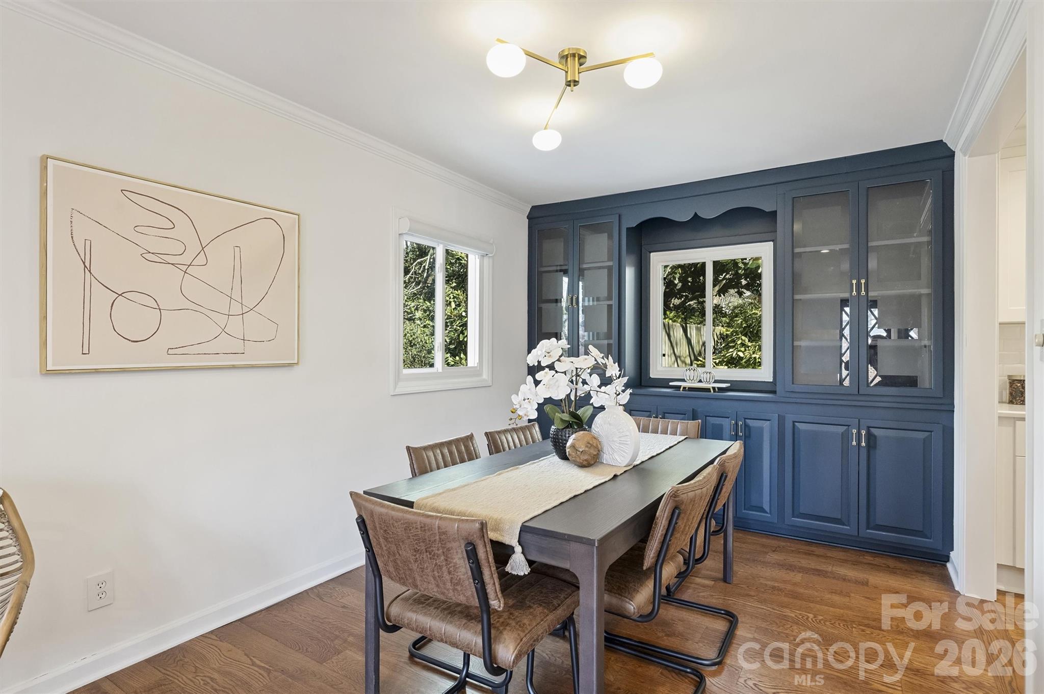 3808 Flowerfield Road Charlotte, NC 28210 - Photo 18 of 48 a view of a dining room that has a table and chairs