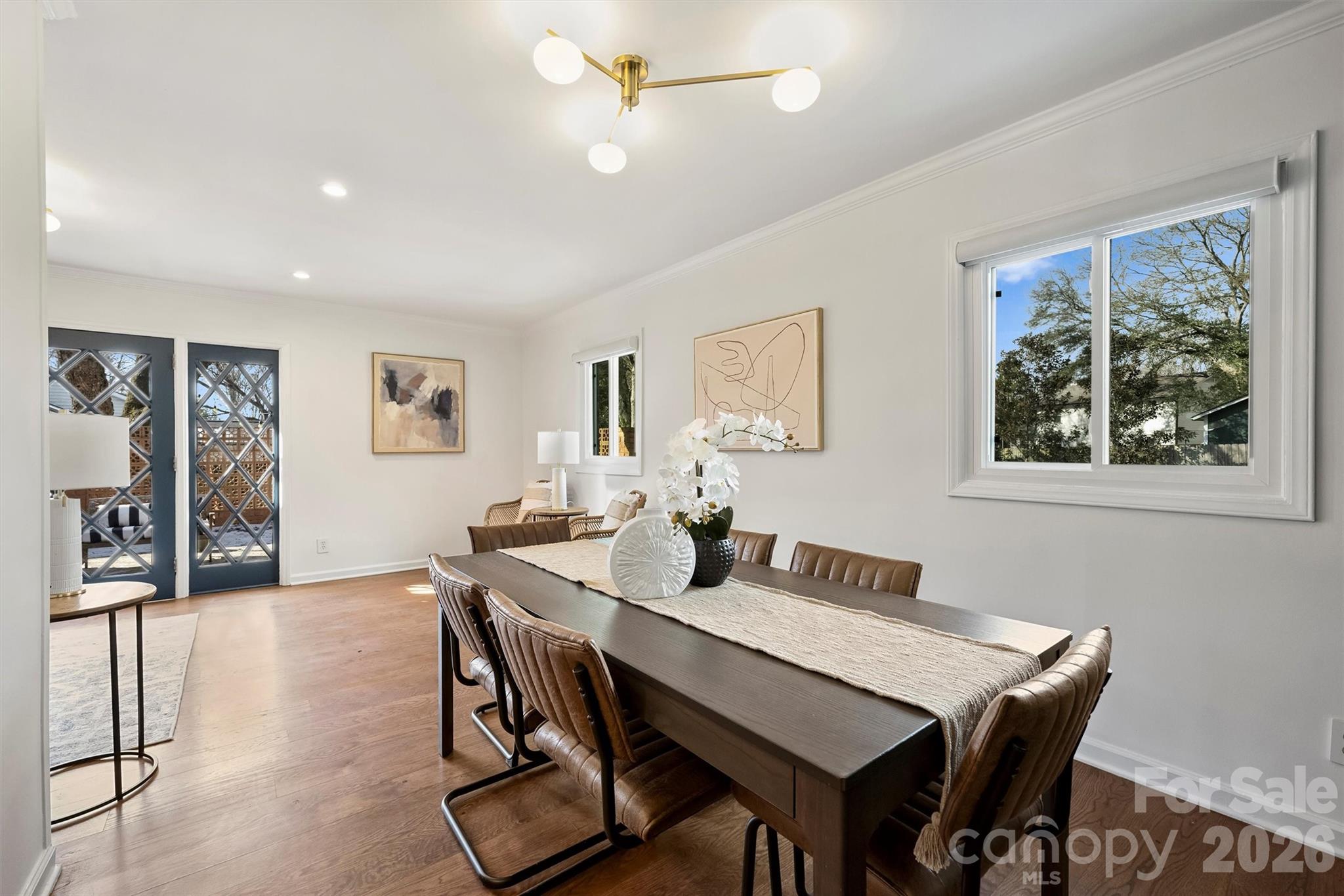 3808 Flowerfield Road Charlotte, NC 28210 - Photo 21 of 48 a view of a dining room with furniture window and wooden floor