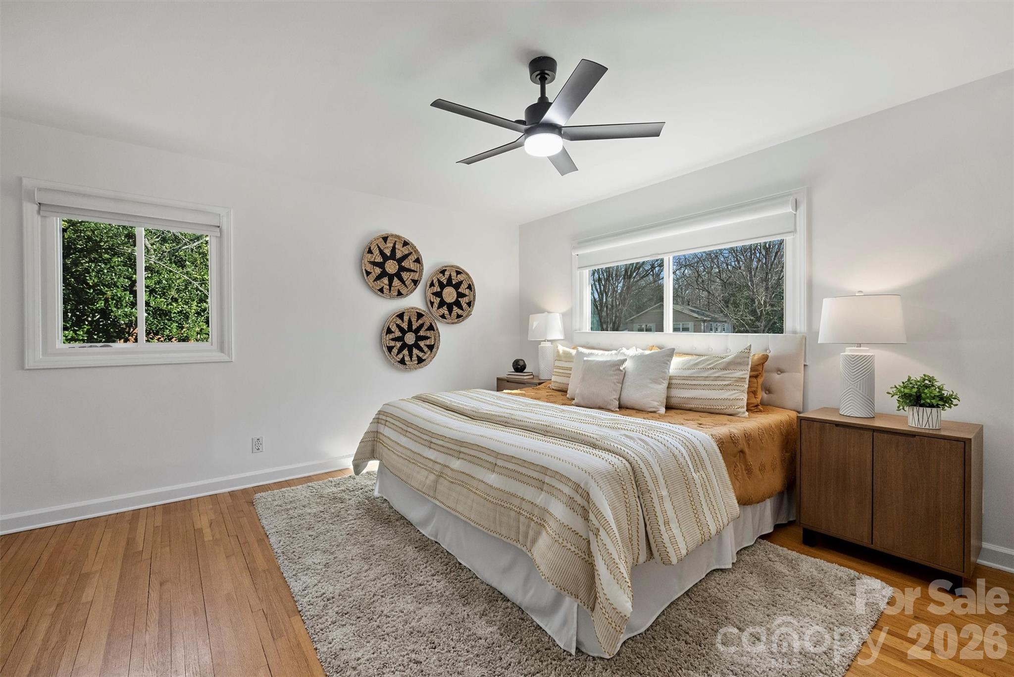 3808 Flowerfield Road Charlotte, NC 28210 - Photo 27 of 48 a bedroom with a large bed and a window