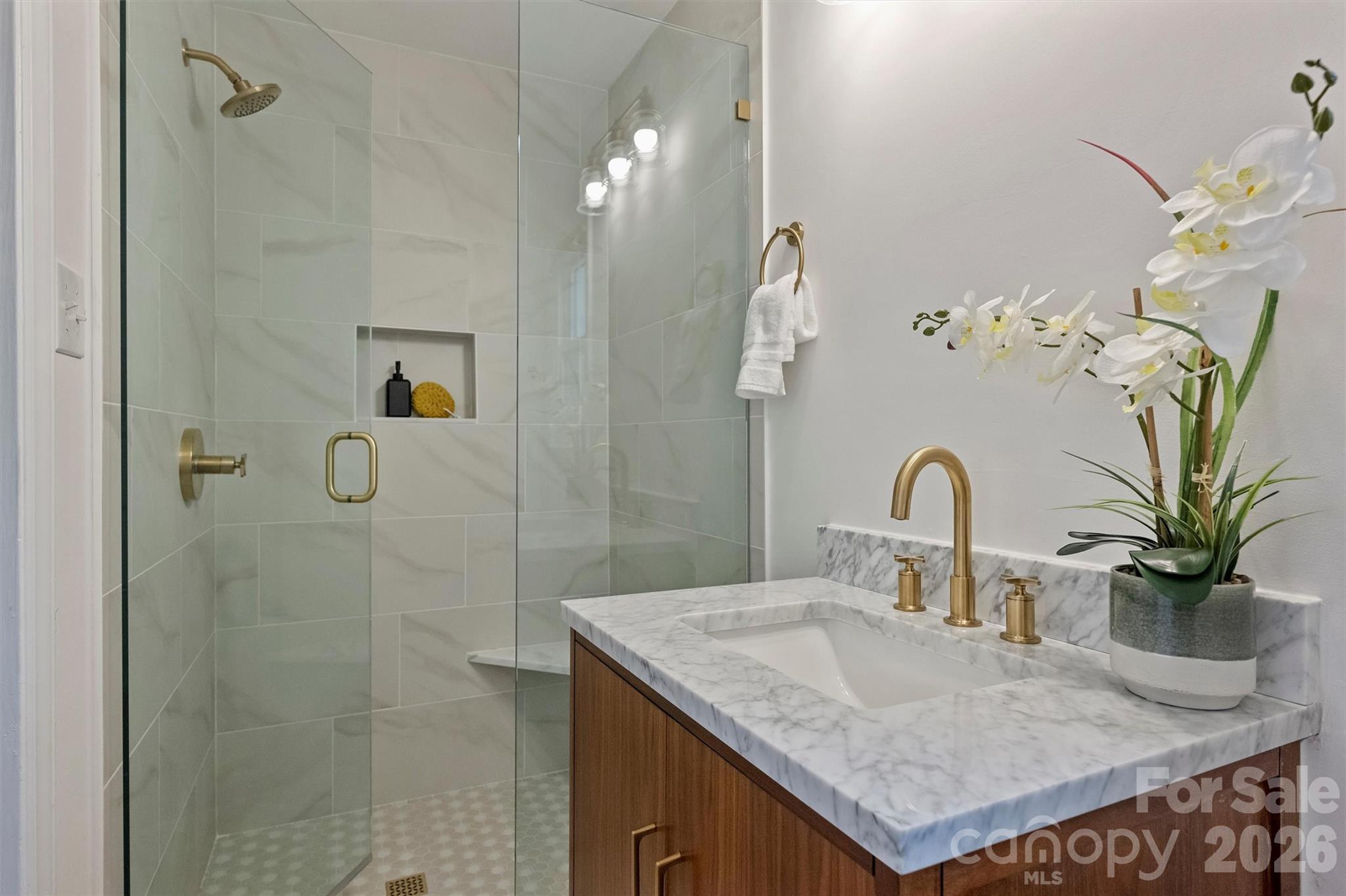 3808 Flowerfield Road Charlotte, NC 28210 - Photo 33 of 48 a bathroom with a granite countertop shower a sink and a mirror