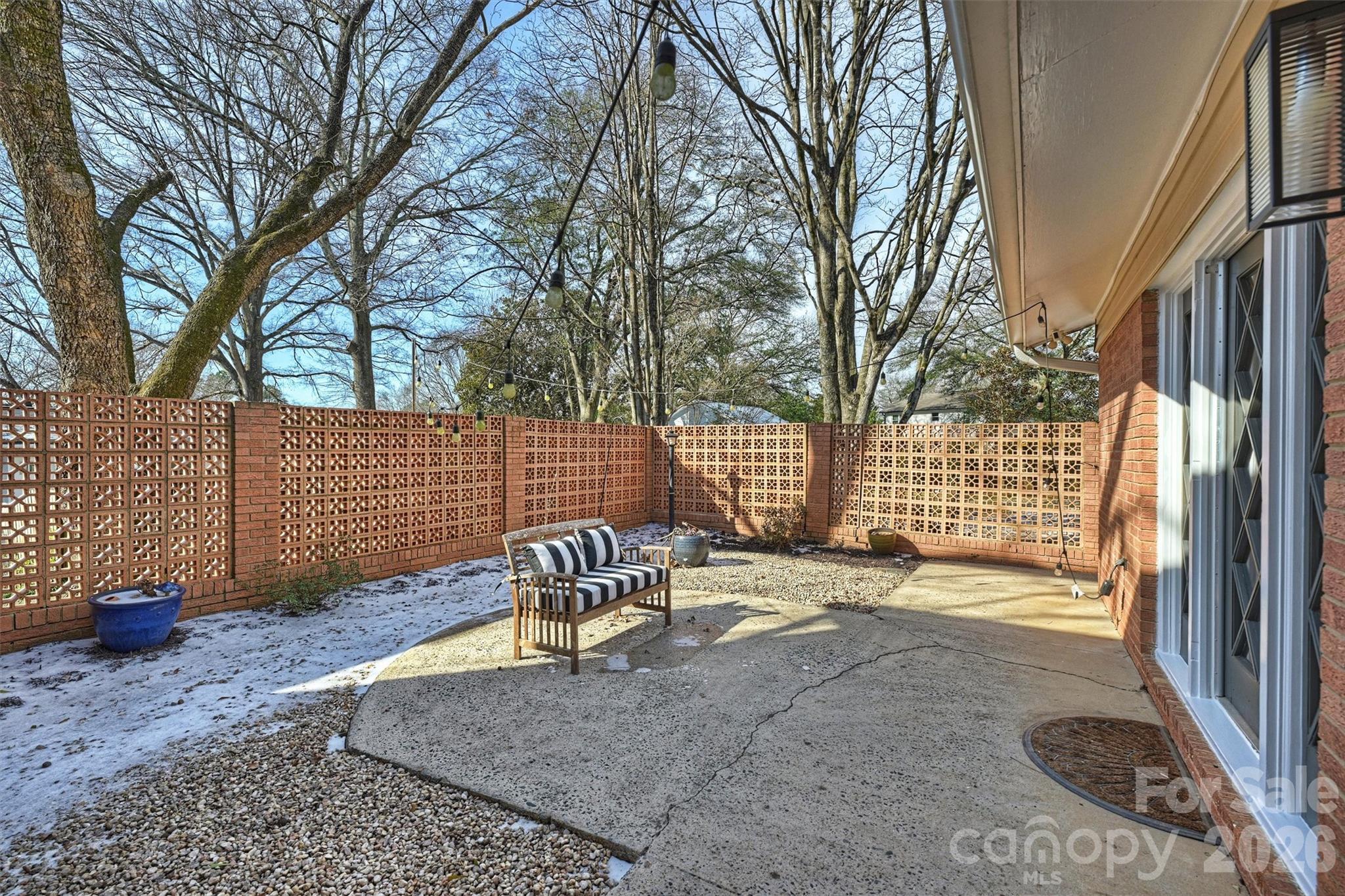 3808 Flowerfield Road Charlotte, NC 28210 - Photo 38 of 48 a view of a backyard with a patio and a garden