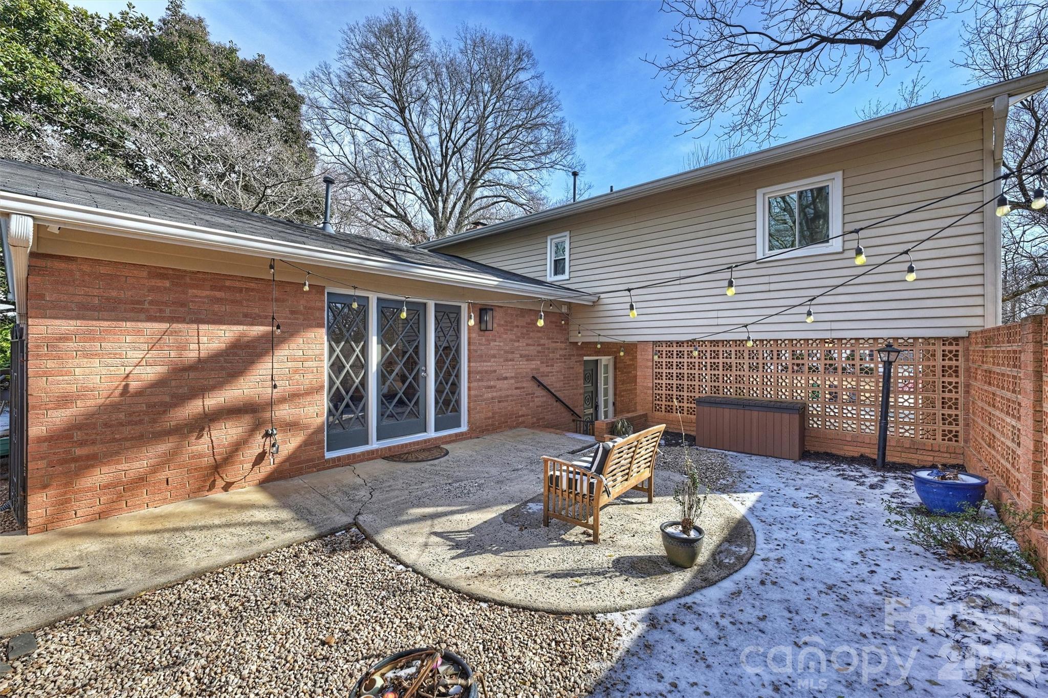 3808 Flowerfield Road Charlotte, NC 28210 - Photo 40 of 48 a front view of house with a garden and patio