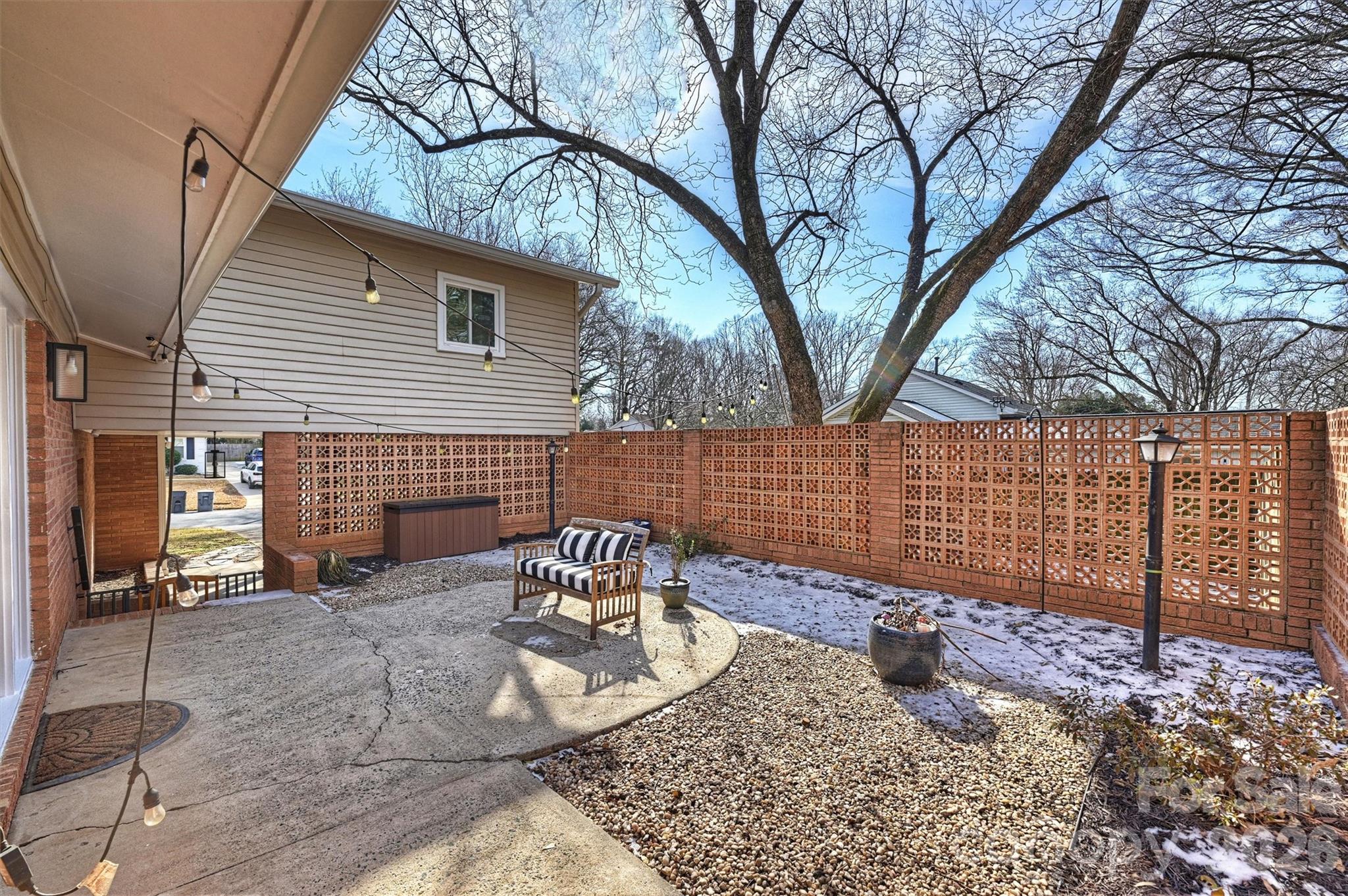 3808 Flowerfield Road Charlotte, NC 28210 - Photo 41 of 48 a view of a backyard with a large tree