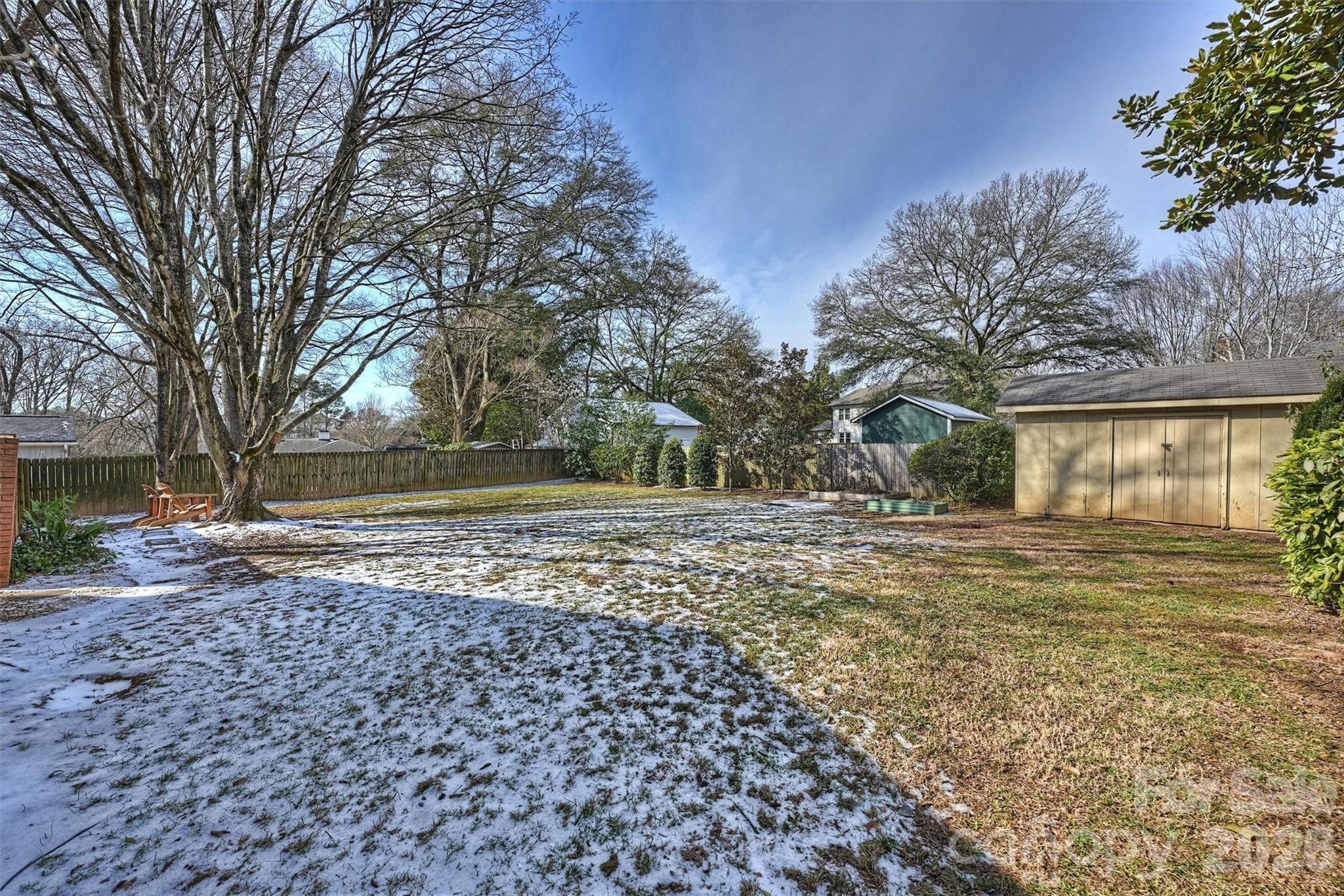 3808 Flowerfield Road Charlotte, NC 28210 - Photo 42 of 48 a view of a yard with plants and trees