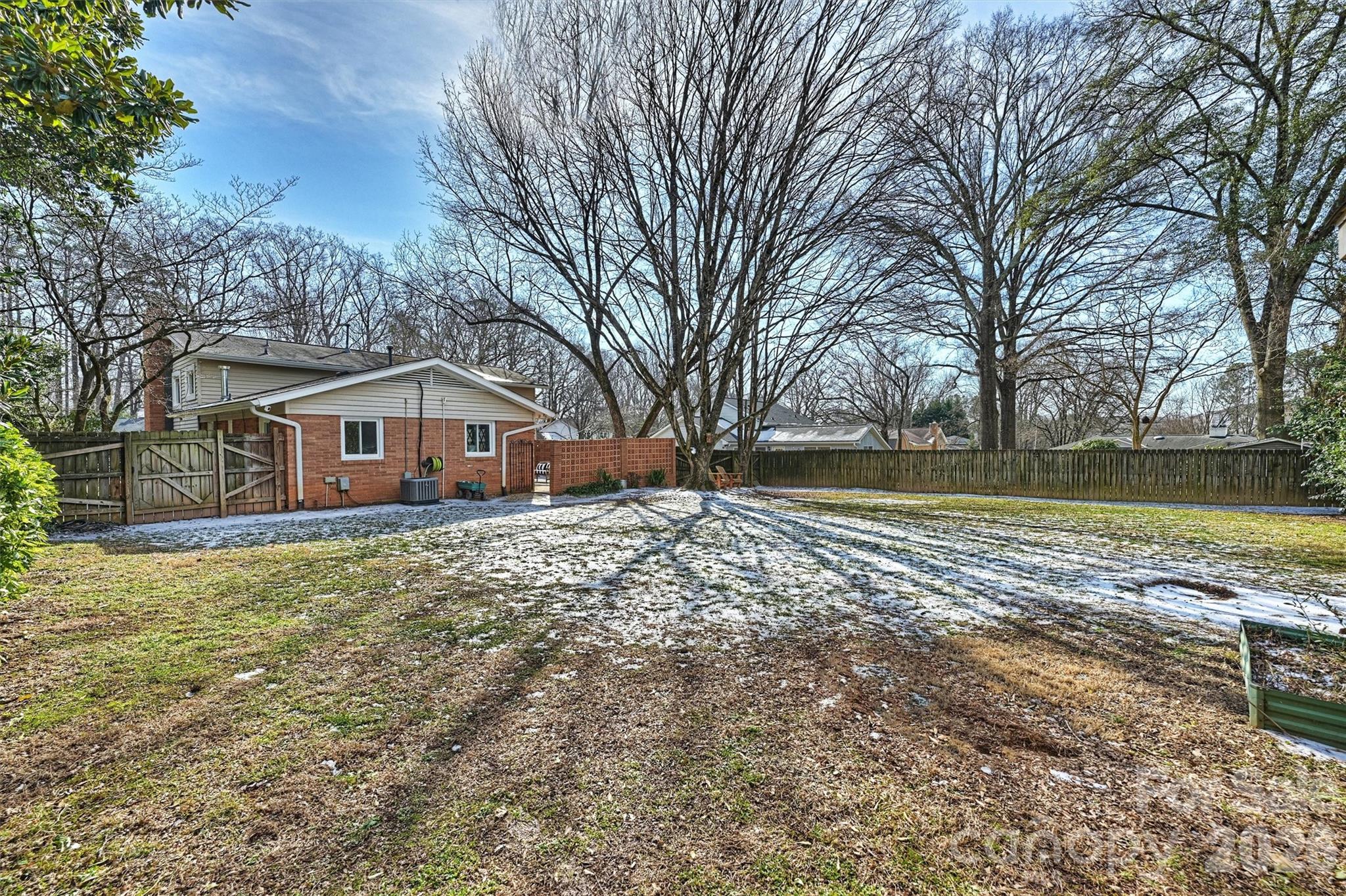 3808 Flowerfield Road Charlotte, NC 28210 - Photo 43 of 48 a front view of house with yard and trees in the background