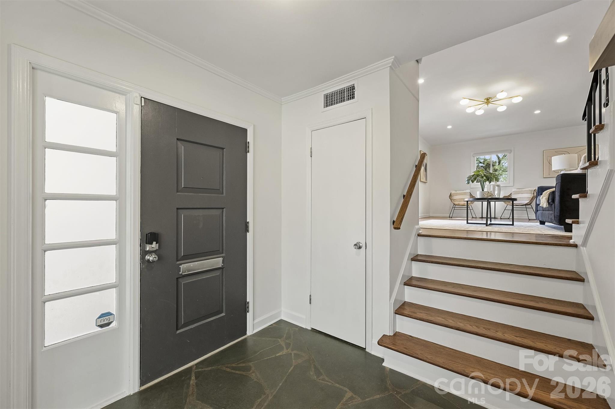 3808 Flowerfield Road Charlotte, NC 28210 - Photo 5 of 48 a view of staircase with white walls and a window