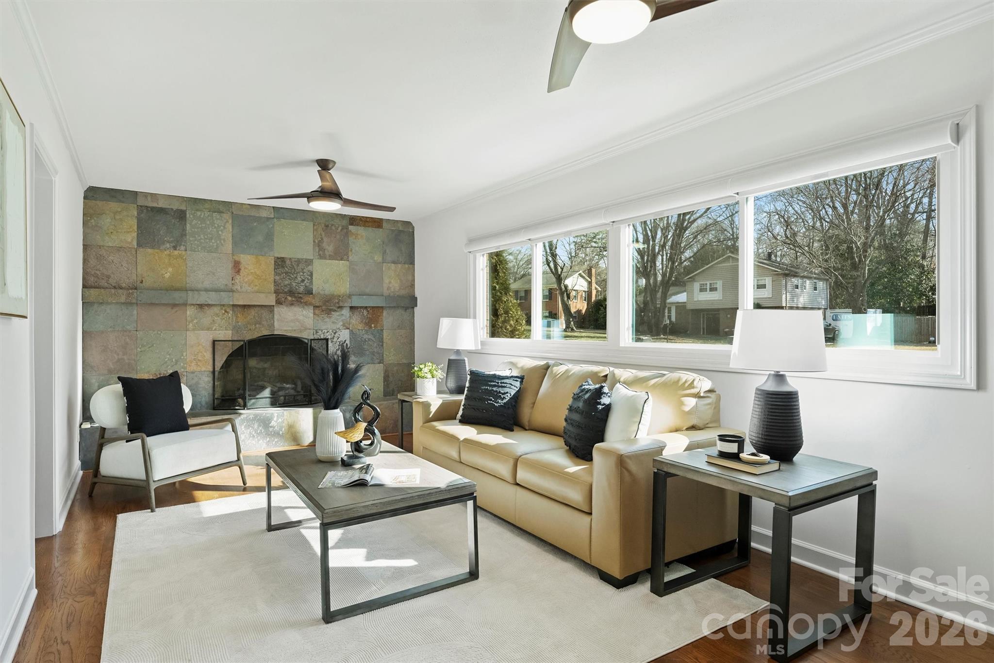 3808 Flowerfield Road Charlotte, NC 28210 - Photo 8 of 48 a living room with furniture and a fireplace