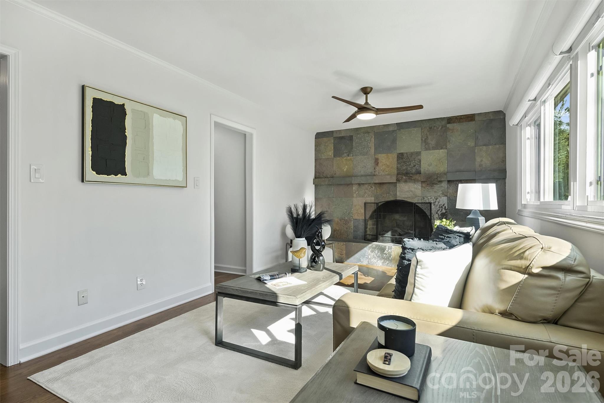 3808 Flowerfield Road Charlotte, NC 28210 - Photo 10 of 48 a living room with furniture a fireplace and a table