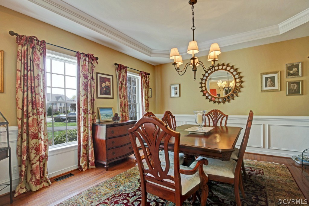 1431 Goswick Ridge Road Midlothian, VA 23114 - Photo 2 of 24 a view of a dining room with furniture window and wooden floor