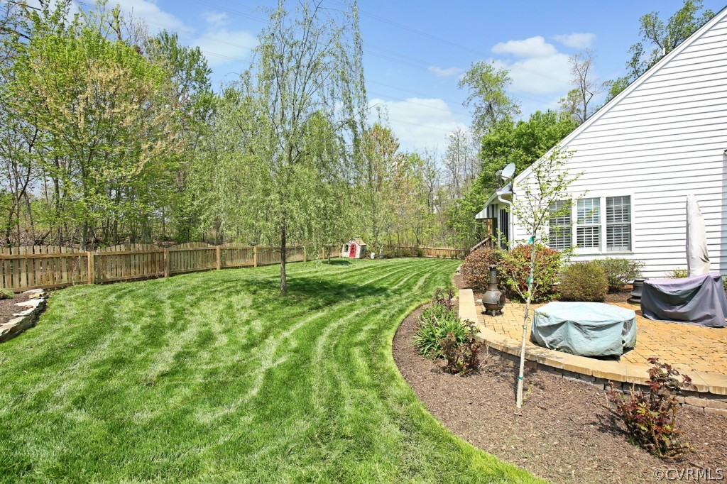 1431 Goswick Ridge Road Midlothian, VA 23114 - Photo 23 of 24 a view of a house with backyard sitting area and garden