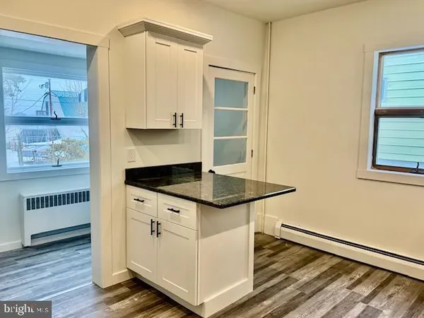 a kitchen with stainless steel appliances granite countertop a stove and a refrigerator