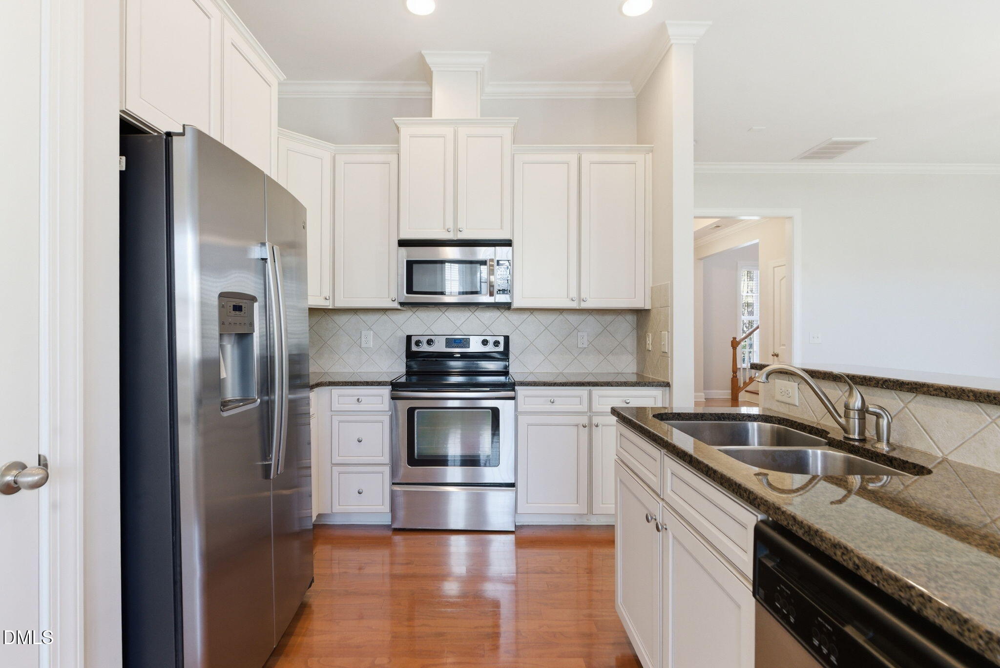 804 Historian Street Raleigh, NC 27603 - Photo 15 of 55 a kitchen with stainless steel appliances granite countertop a sink stove and refrigerator