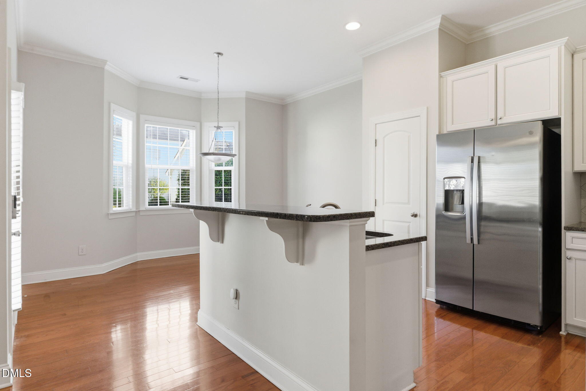 804 Historian Street Raleigh, NC 27603 - Photo 22 of 55 a kitchen with stainless steel appliances a refrigerator and a window