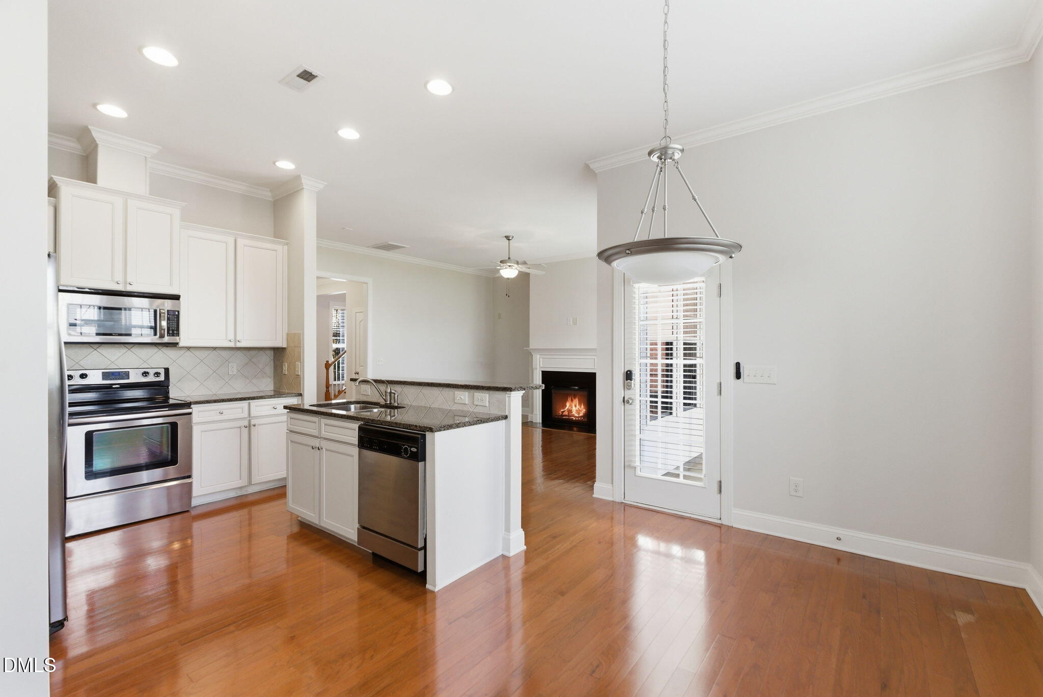 804 Historian Street Raleigh, NC 27603 - Photo 23 of 55 a kitchen with granite countertop a stove and a refrigerator