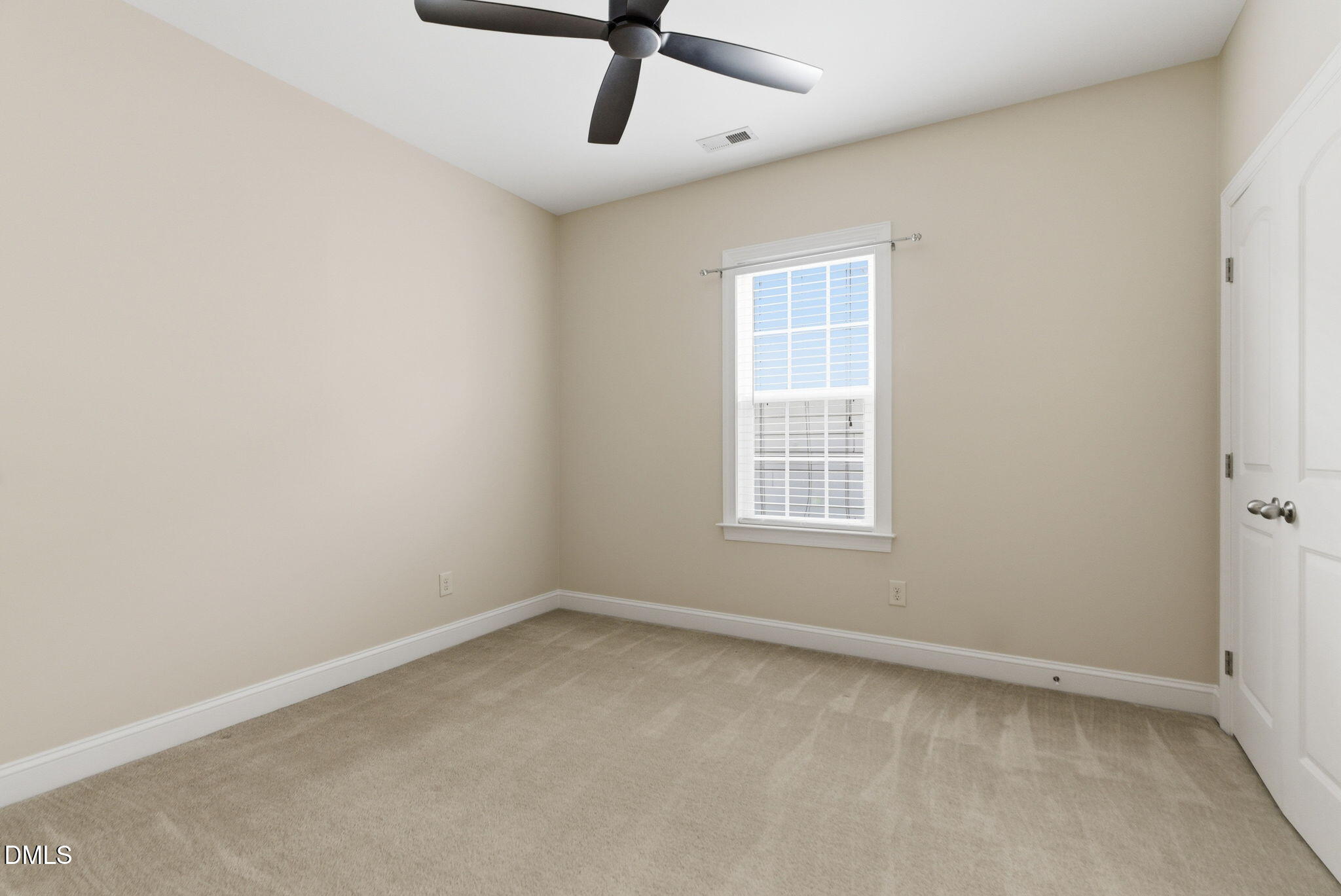 804 Historian Street Raleigh, NC 27603 - Photo 40 of 55 an empty room with a window and a fan