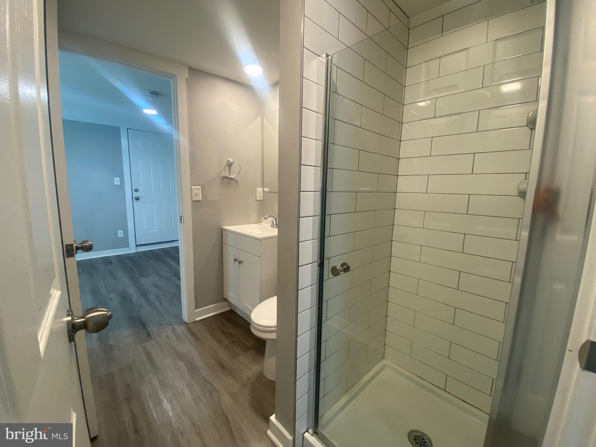 218 West King Street, Unit 3 Lancaster, PA 17603 - Photo 5 of 8 a bathroom with a shower and a toilet