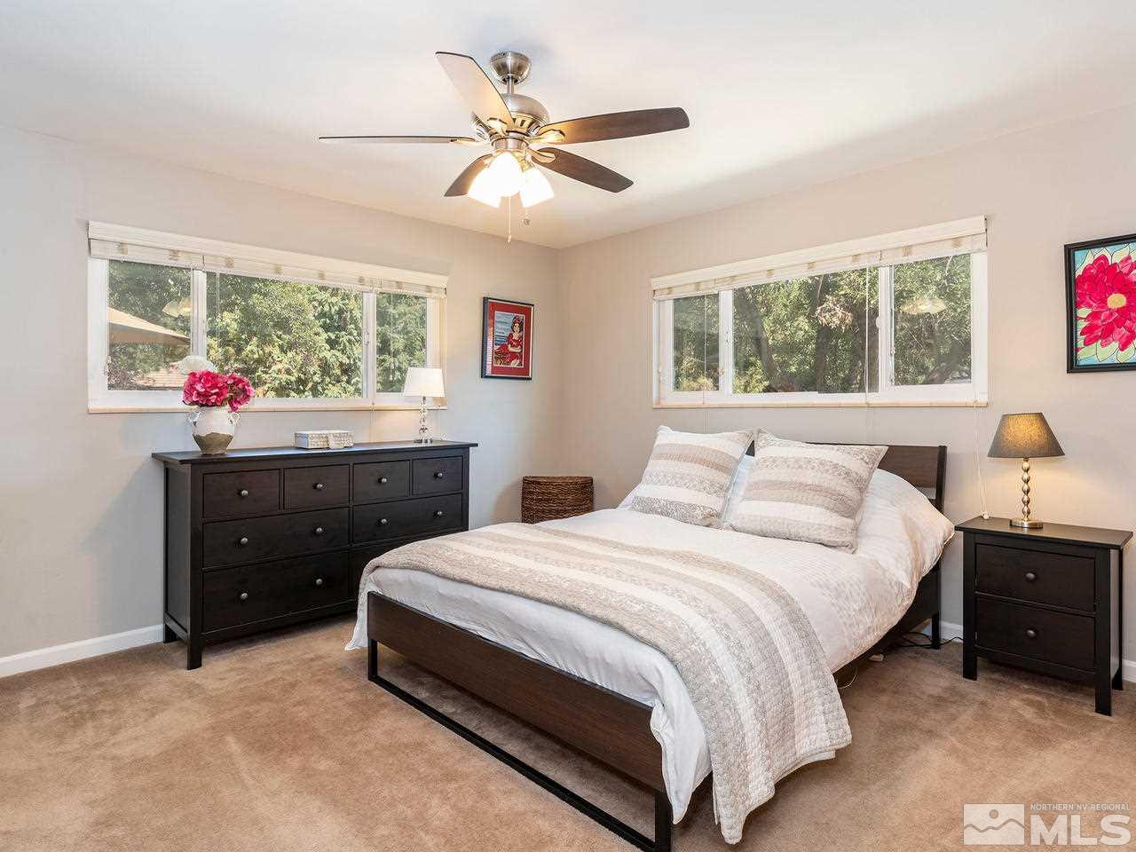 525 Harbin Lane Reno, NV 89509 - Photo 14 of 25 a bedroom with a bed and window