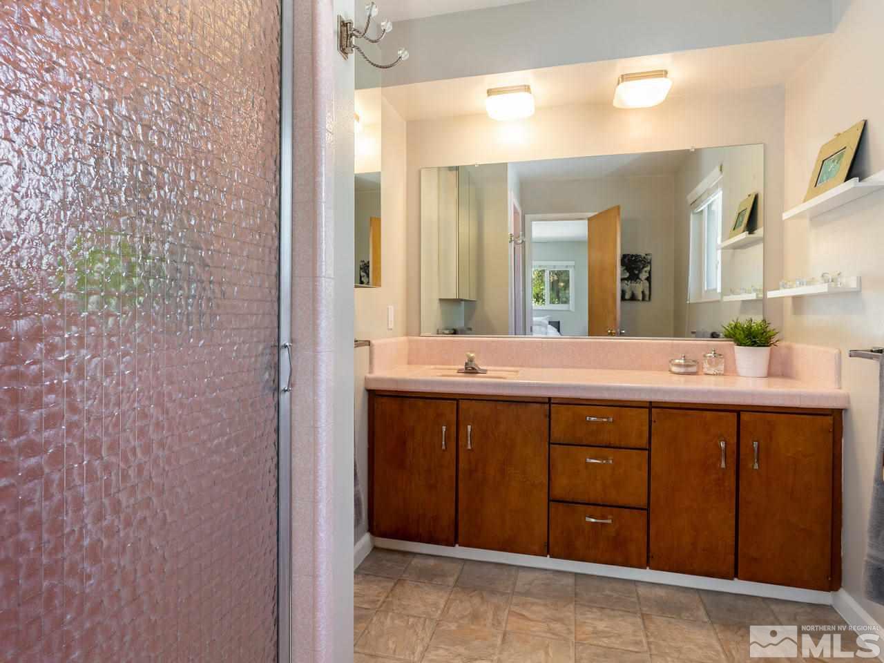 525 Harbin Lane Reno, NV 89509 - Photo 15 of 25 a bathroom with a sink and a mirror