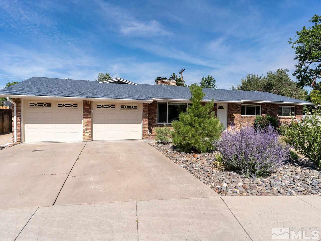 525 Harbin Lane Reno, NV 89509 - Photo 2 of 25 a front view of a house with a yard