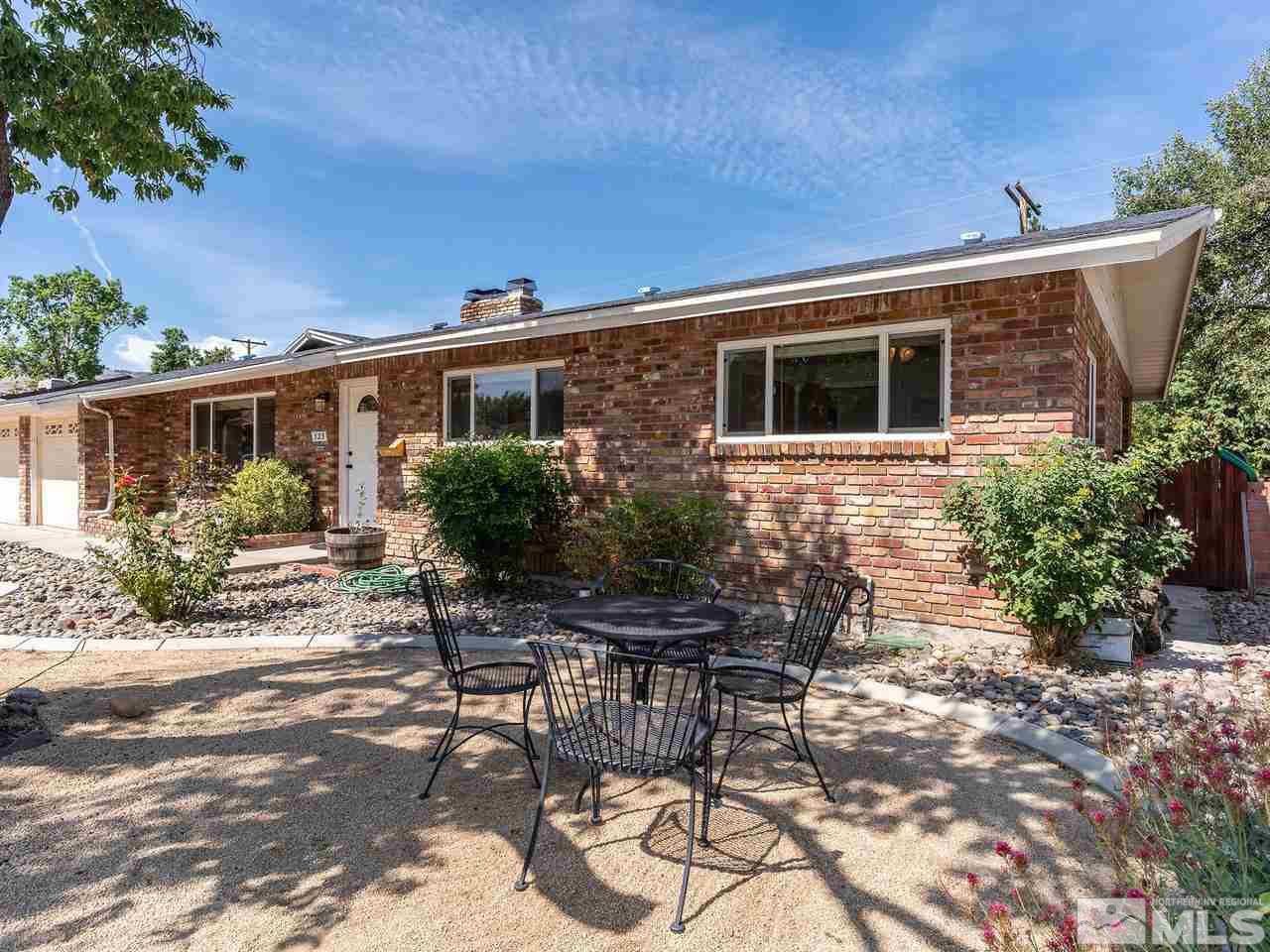 525 Harbin Lane Reno, NV 89509 - Photo 3 of 25 a view of a house with backyard sitting area and garden