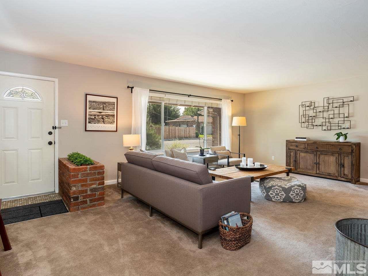 525 Harbin Lane Reno, NV 89509 - Photo 4 of 25 a living room with furniture and a large window
