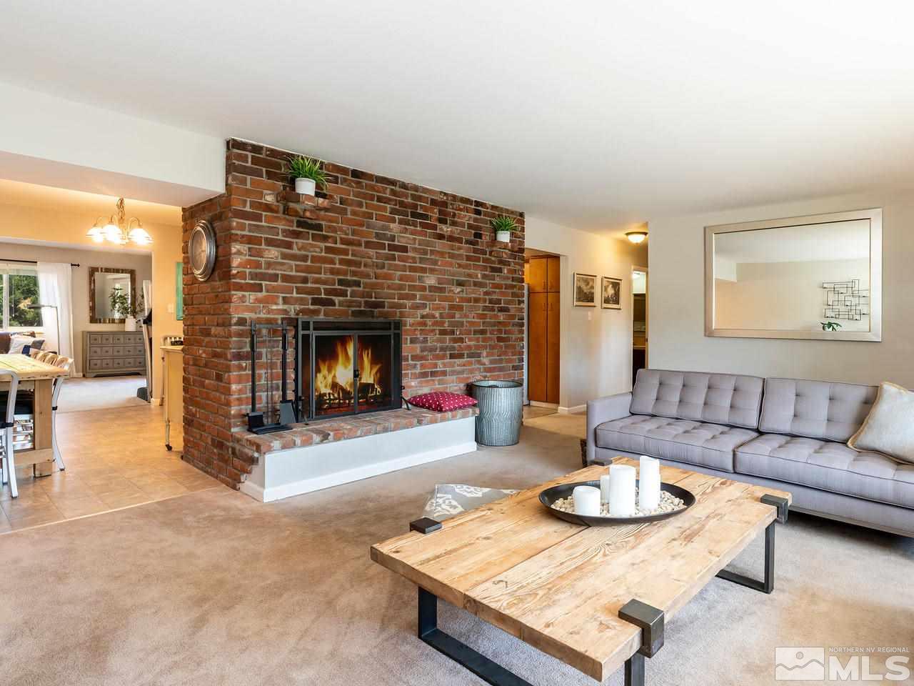 525 Harbin Lane Reno, NV 89509 - Photo 6 of 25 a living room with furniture and a fireplace