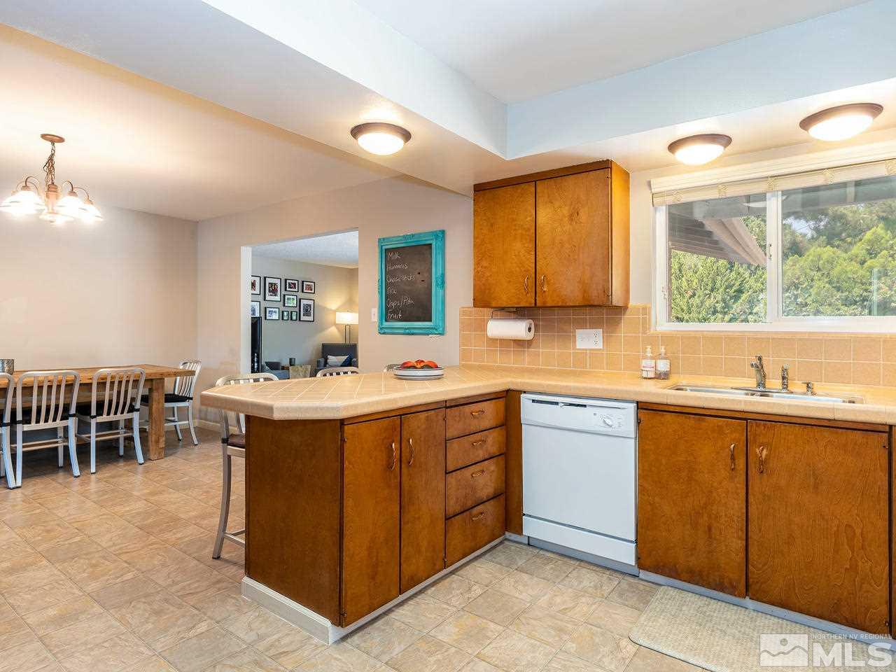 525 Harbin Lane Reno, NV 89509 - Photo 7 of 25 a kitchen with a sink counter top space and appliances