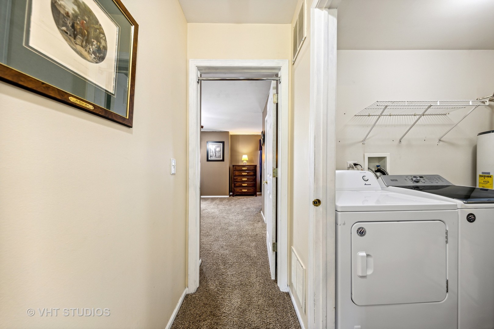 782 County Line Road Aurora, IL 60502 - Photo 16 of 19 a view of a hallway with washer and dryer