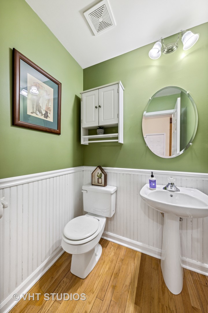 782 County Line Road Aurora, IL 60502 - Photo 9 of 19 a bathroom with a toilet a sink and mirror