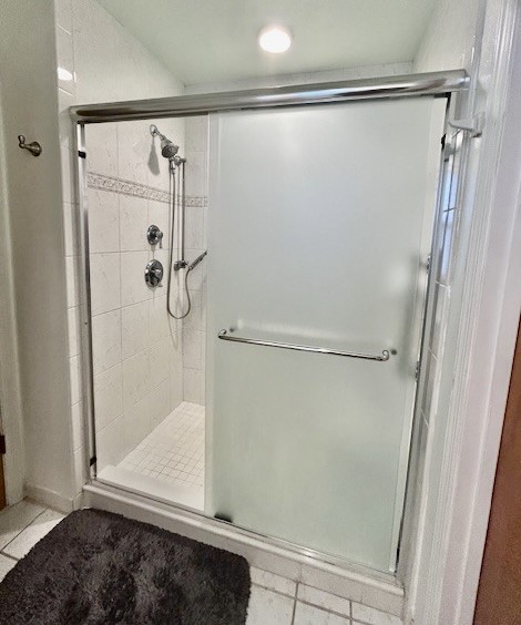 7971 Waupegan Avenue Sebastian, FL 32958 - Photo 16 of 26 a bathroom with a glass shower door