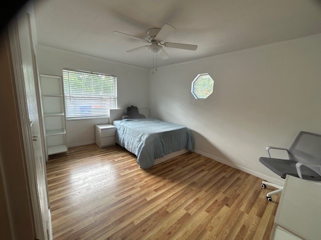 7971 Waupegan Avenue Sebastian, FL 32958 - Photo 18 of 26 a bedroom with a bed and window