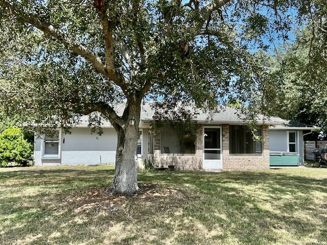 7971 Waupegan Avenue Sebastian, FL 32958 - Photo 21 of 26 a front view of a house with garden